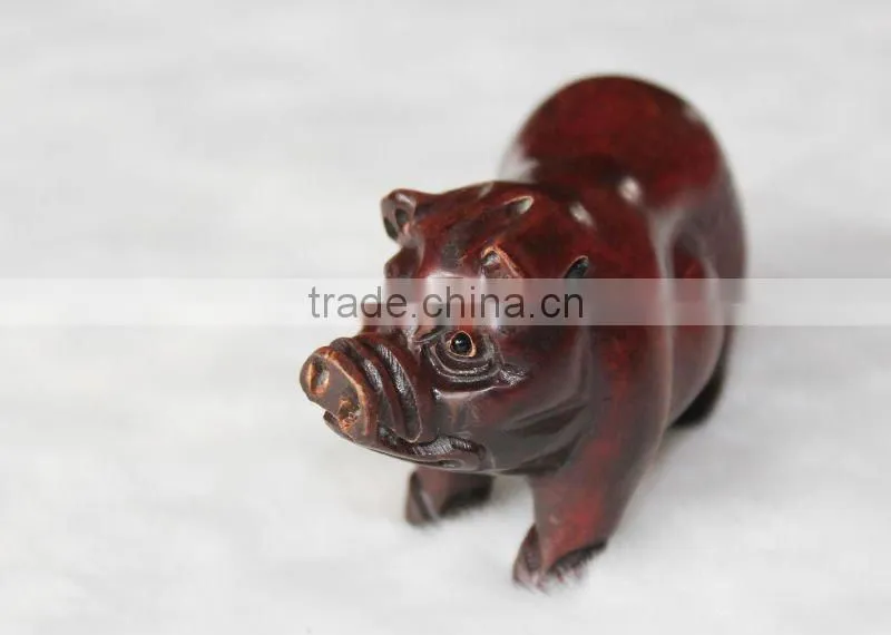 Artistic sandalwood carving pig