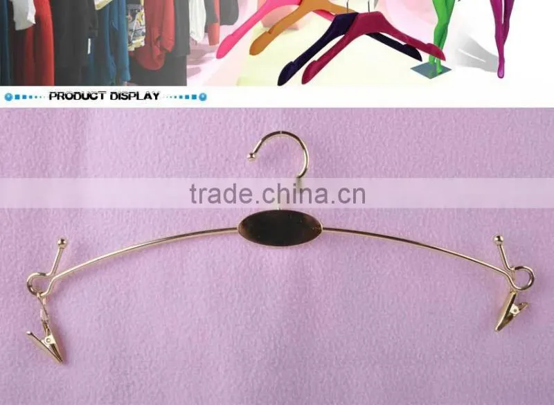 Gold metal hanger with clips for bikini clothes