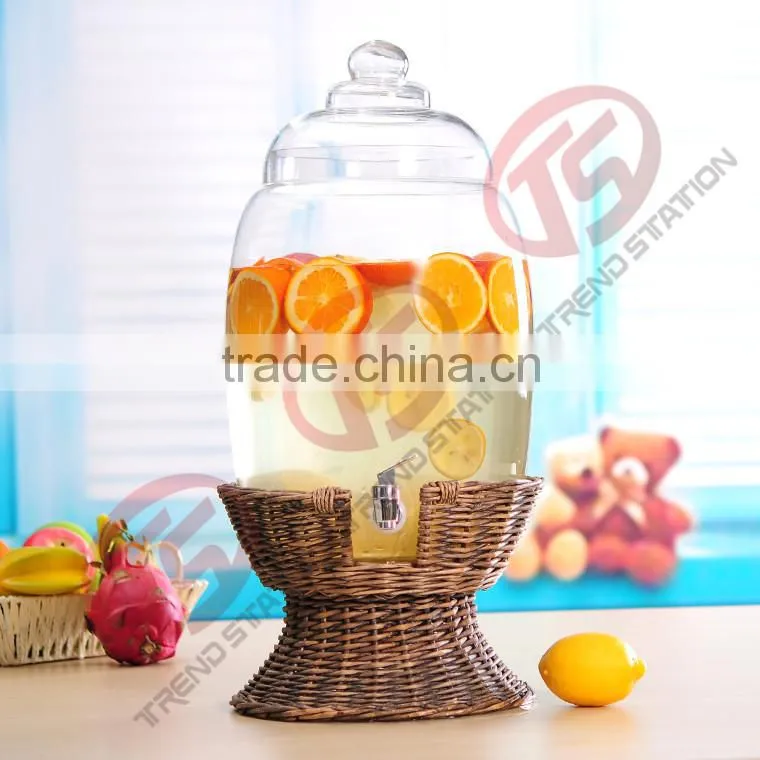 large glass beverage dispenser with willow base and spigot