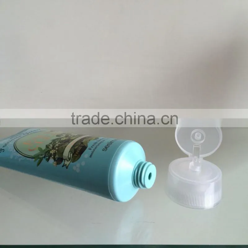 face cleansing cosmetics tube with snap-on flip top caps