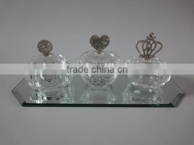 small empty clear crystal perfume bottle with jewelled metal alloy handle
