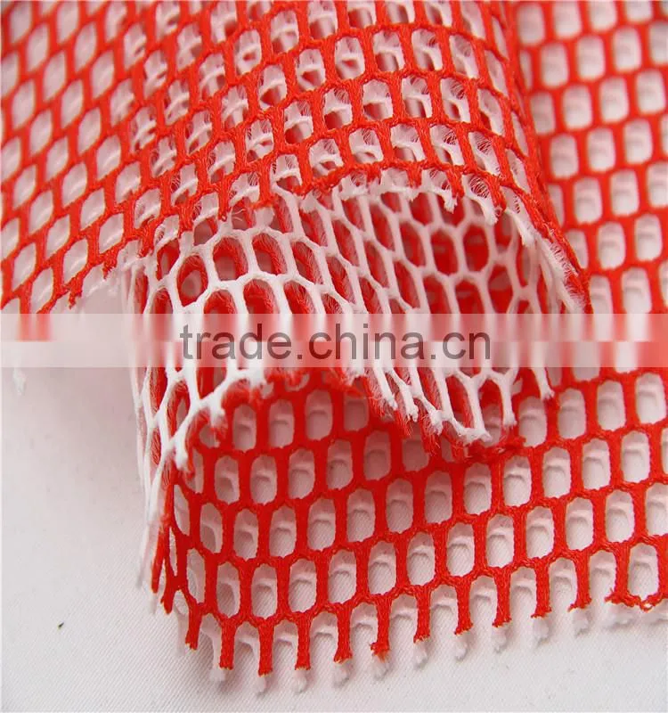 Cationic color low elastic macroporous mesh fabric