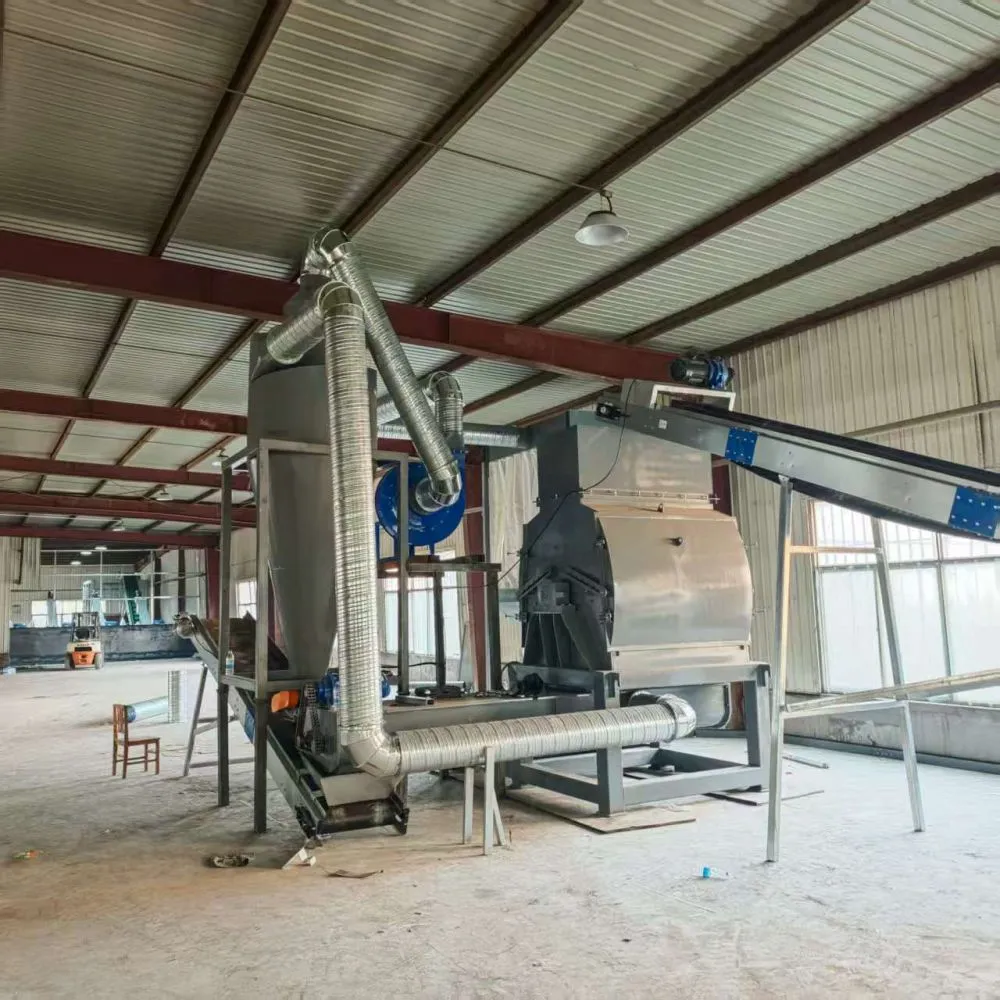 What are the uses of the wood powder produced by a hammer mill?