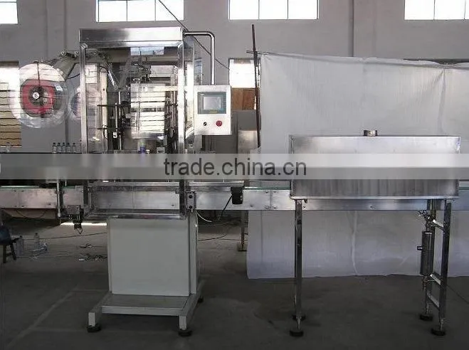 Automatic sleeve shrink packer for bottles