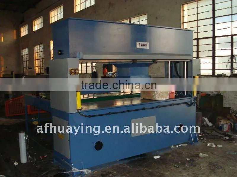 Semi-automatic travelling head rubber cutting machine