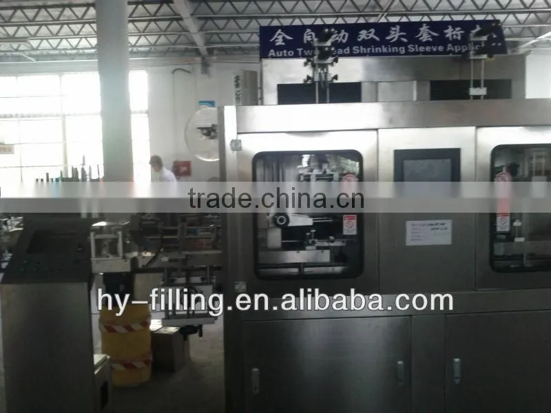 Double head sleeve labeling machine
