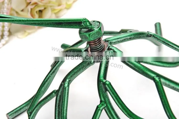 Metal display stand for jewelry with a birdcage for earrings