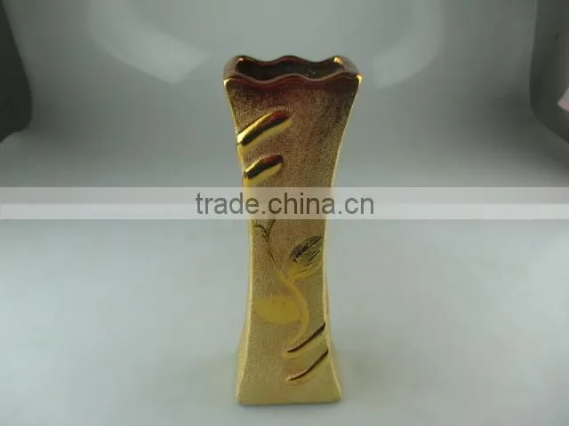 beautiul golden porcelain type vase with flower design