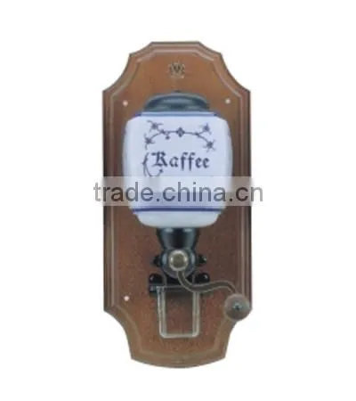 archaistic manual coffee grinder with wooden case