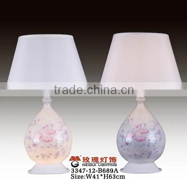 white glass lamp with surface flower
