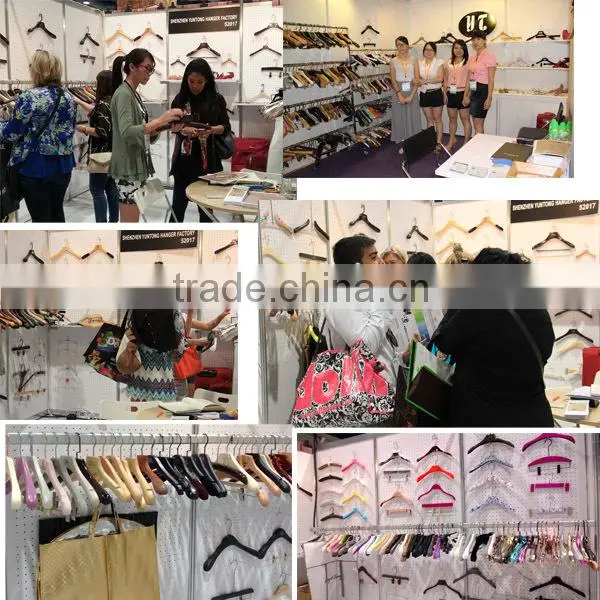 bright black high end wooden clothing hanger and pants hanger