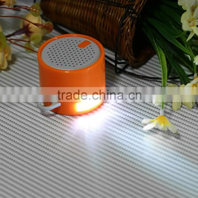 Popular portable mini bluetooth speaker with phone stand and LED torch lighting