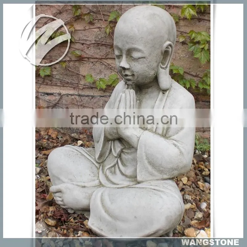 Modern little monk with hand carved stone sculpture by priestling buddha head statue