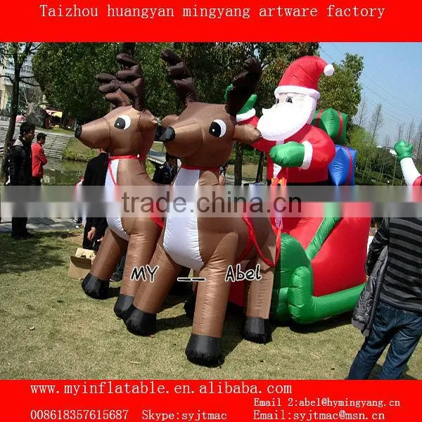 Christmas decorations santa and penguin by train