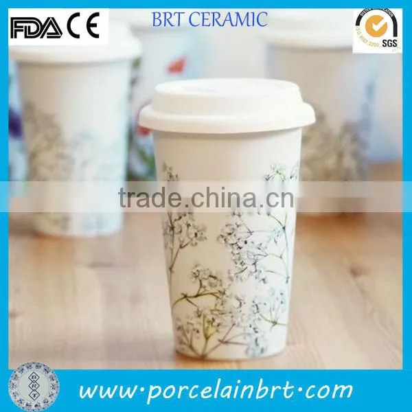 white ceramic travel mug with silicon lid