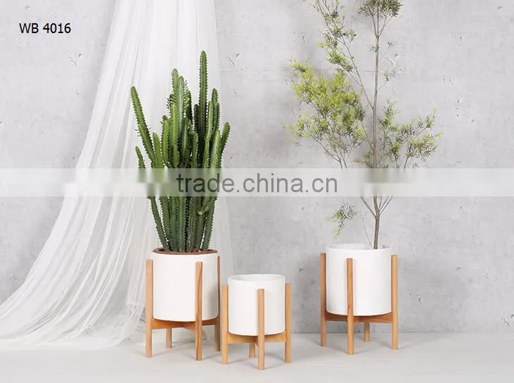 walnut / beech wood stand with smooth matte pot concrete planter pot