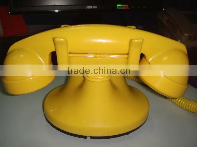 Yellow Rotary dial telephone