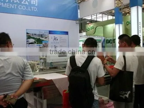 Automatic tucking sewing machine