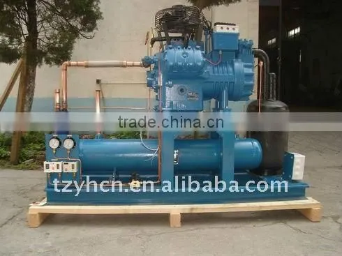Two stage piston compressor