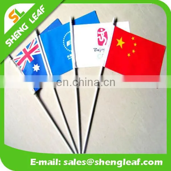 Paper hand waving flag,a national flag of Canada