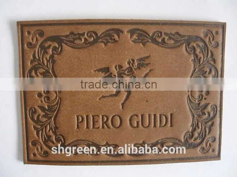 Dark brown irregular false leather label for pants