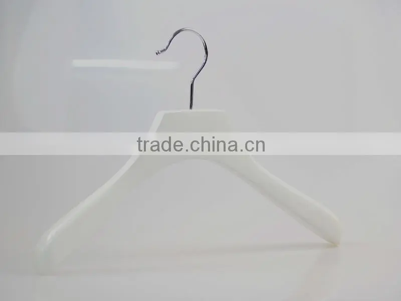 white wooden hanger and pants hanger for luxury garment