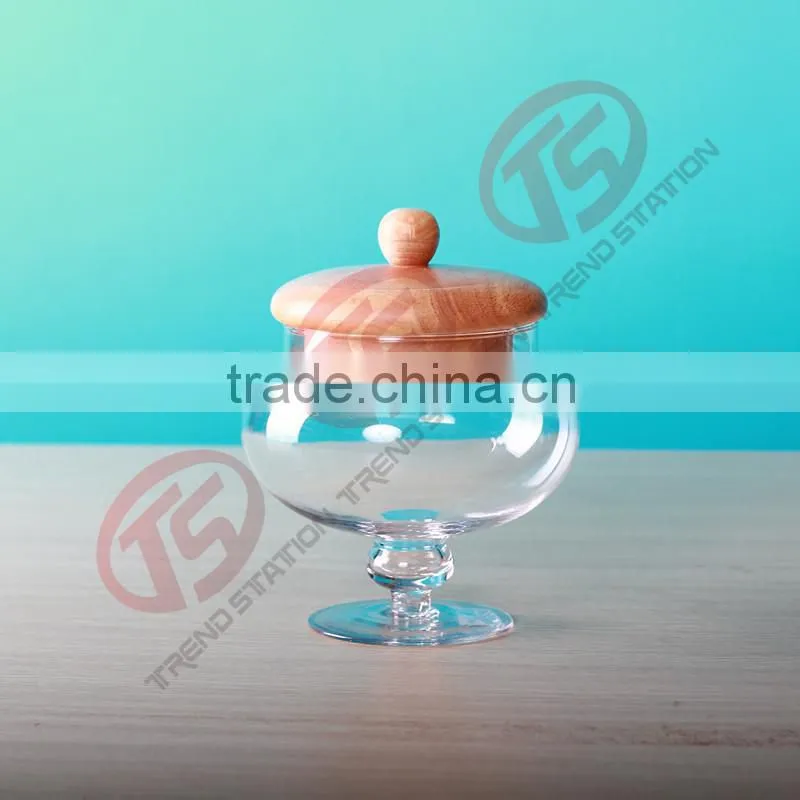 round glass jars and wooden lids with stemmed