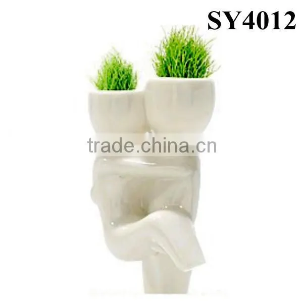 With grass hair white man growing grass doll