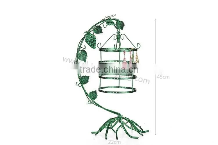 Metal display stand for jewelry with a birdcage for earrings