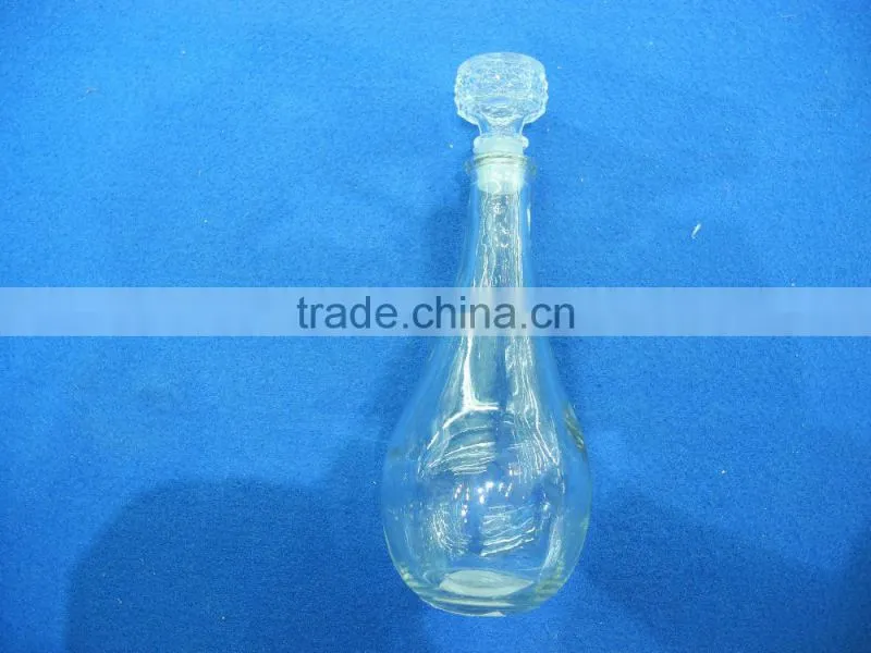 sealed clear glass drinking bottle with glass cork lid