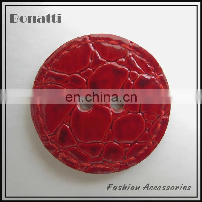 black leather button