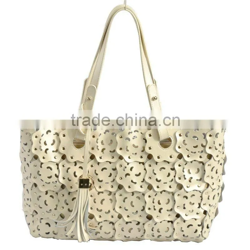 2012 fashion leather handbag ladies bag with punch flower patterns!