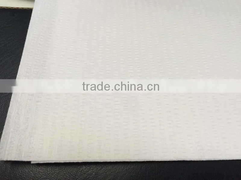 Creped nonwoven spunlace woodpulp polyester