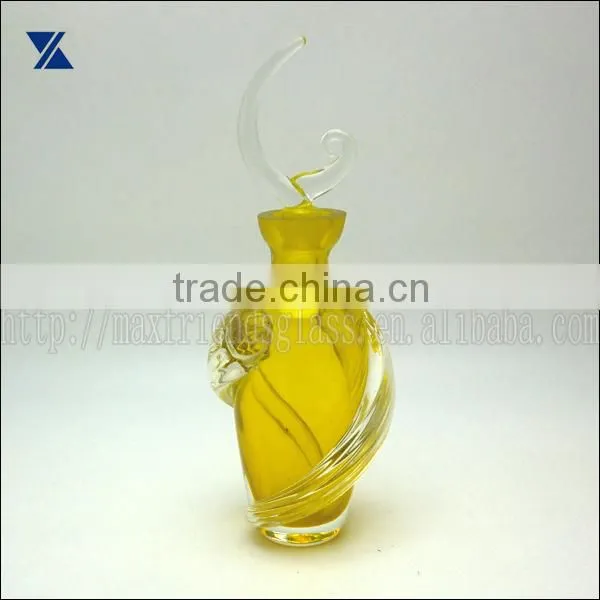 mouth blown yellow with clear swirl deco glass perfume bottle