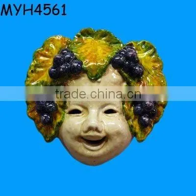 A sweet, handmade and hand painted Italian ceramic mask adorned with grapes