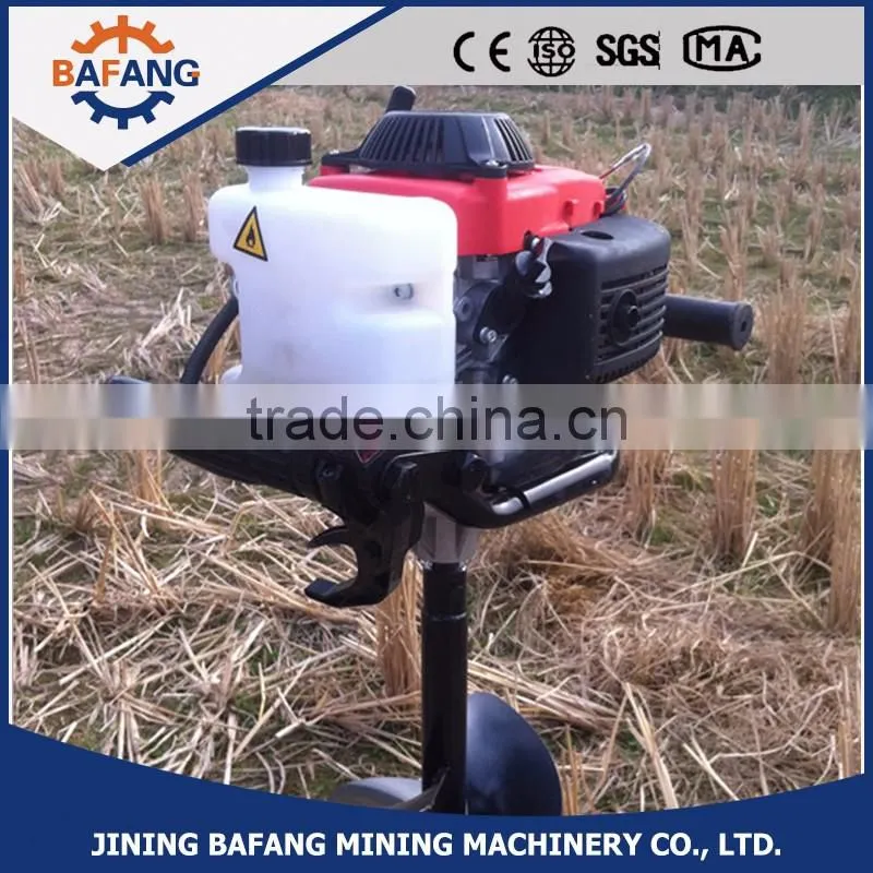 Hand held person tree hole digging machine