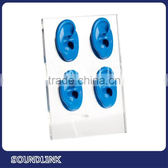 Clear Acrylic display rechargeable mini hearing aid with four ears