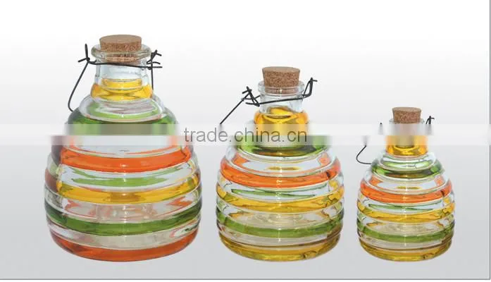 yellow glass bees catcher with cork stopper and hanging handle