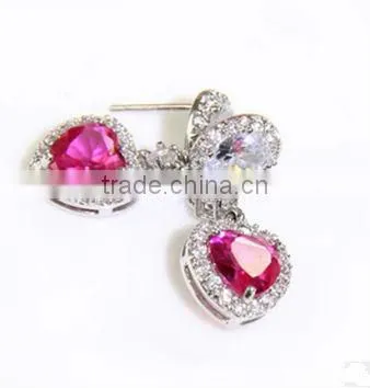 Ruby earrings, noble earrings. Simulation of diamond earrings
