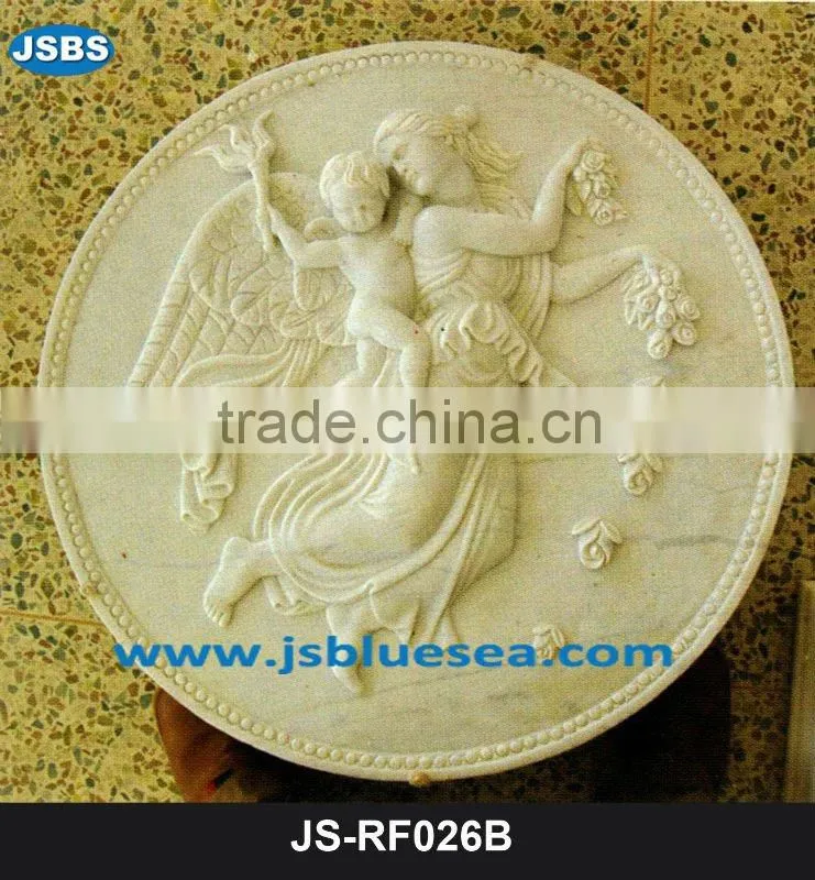 Stone carving of flower wall relief