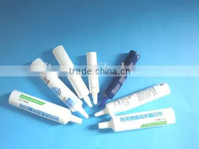 Cosmetic tube with silicone valve flip top