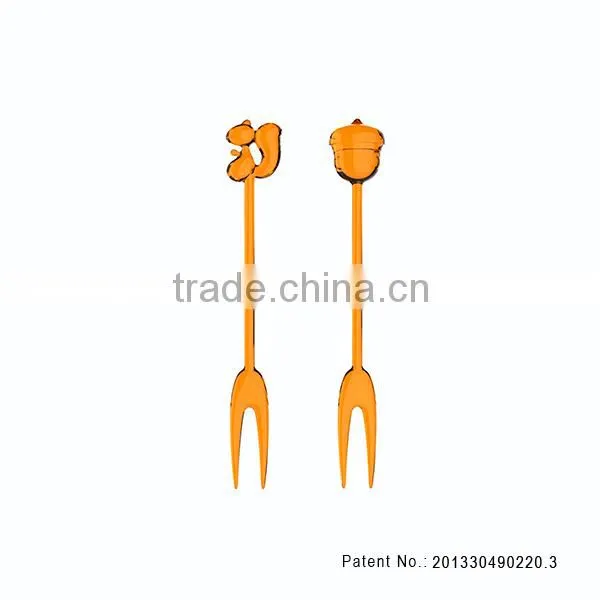 Silicone squirrel-and-pinecone honey dipper