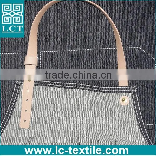 black denim apron with leather straps