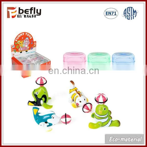 Novelty toy plastic wind-up chick in capsule
