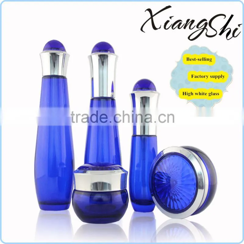 cosmetics cream glass bottles and jars blue