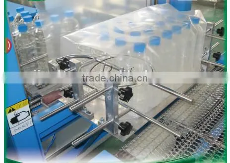 Professional full automatic film shrinking wrapping packing machine for PET bottle