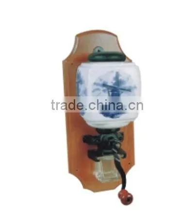 archaistic manual coffee grinder with wooden case