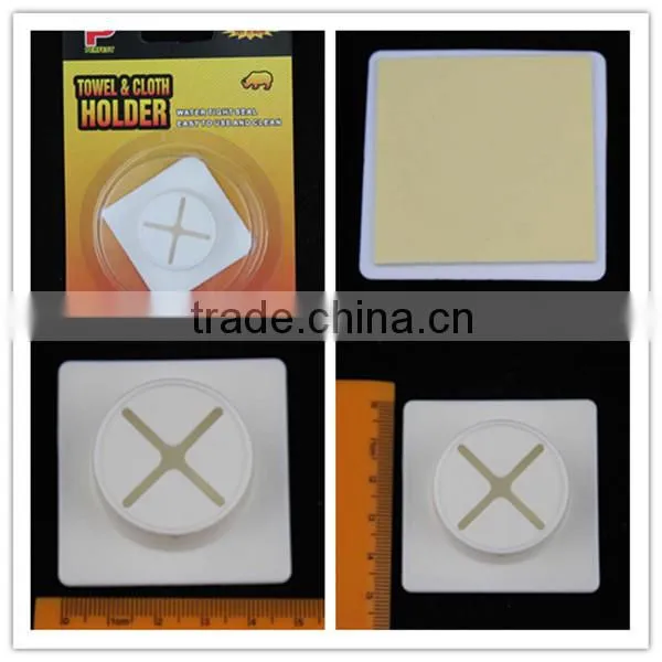 Removable self adhesive plastic towel grip