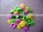 Raincoat plastic button