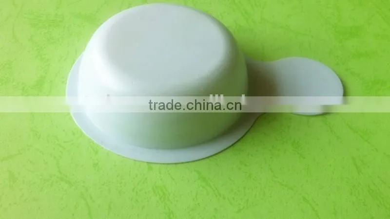white disposable plastic tray for urine testing.